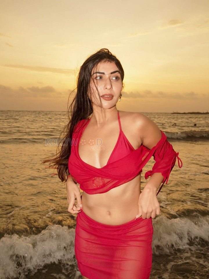 Temptation Island Beauty Ruma Sharma in a Red Sheer Long Sleeved Crop Top and Mini Skirt over a Bikini Photos 04