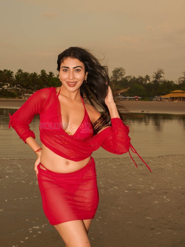 Temptation Island Beauty Ruma Sharma in a Red Sheer Long Sleeved Crop Top and Mini Skirt over a Bikini Photos 08