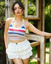 Charming Actress Avneet Kaur in a Striped Halter Crop Top White Ruffle Mini Skirt Photos 01