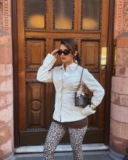 Chic Beauty Avneet Kaur in a White Shirt with Brown Mini Skirt and Printed Long Socks Photos 05