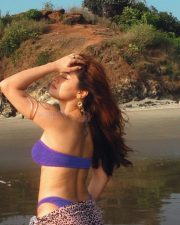 Gorgeous Avneet Kaur in a Strapless Purple Bandeau Bikini with a Leopard Print Sarong Pictures 03