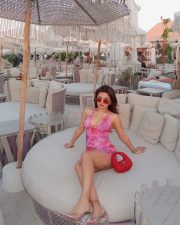 Love in Vietnam Heroine Avneet Kaur in a Pink Floral Halter Mini Dress with Cleavage Neckline Photos 08