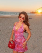 Love in Vietnam Heroine Avneet Kaur in a Pink Floral Halter Mini Dress with Cleavage Neckline Photos 09