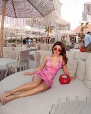 Love in Vietnam Heroine Avneet Kaur in a Pink Floral Halter Mini Dress with Cleavage Neckline Photos 10