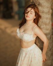 Party Till I Die Actress Avneet Kaur in a White and Pink Floral Printed Ruffle Crop Top with a Ruched Bust and a High Waisted Flowy Maxi Skirt Pictures 04