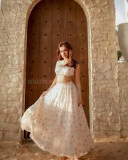 Party Till I Die Actress Avneet Kaur in a White and Pink Floral Printed Ruffle Crop Top with a Ruched Bust and a High Waisted Flowy Maxi Skirt Pictures 05