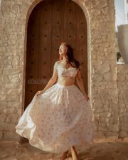 Party Till I Die Actress Avneet Kaur in a White and Pink Floral Printed Ruffle Crop Top with a Ruched Bust and a High Waisted Flowy Maxi Skirt Pictures 06