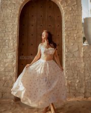 Party Till I Die Actress Avneet Kaur in a White and Pink Floral Printed Ruffle Crop Top with a Ruched Bust and a High Waisted Flowy Maxi Skirt Pictures 06