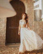 Party Till I Die Actress Avneet Kaur in a White and Pink Floral Printed Ruffle Crop Top with a Ruched Bust and a High Waisted Flowy Maxi Skirt Pictures 08