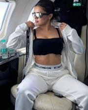 Sexy Avneet Kaur in a Black Bralette with a White Jacket and Pant Photos 03