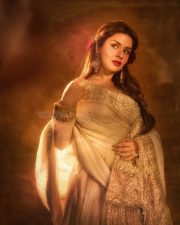 Sexy Model Avneet Kaur in a Royal Ivory White and Gold Anarkali Dress Photos 05
