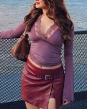 Stylish Actress Avneet Kaur in a Mauve Lace Wrap Top and Burgundy Leather Mini Skirt Photos 01