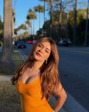 Stylish Actress Avneet Kaur in a Orange Tank Top and Blue Jeans Photos 04