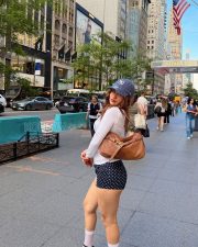 Stylish Actress Avneet Kaur in a White Long sleeve Top and Navy Polka Dot Shorts Photos 02