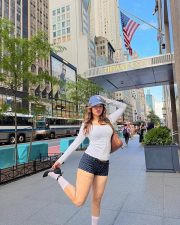 Stylish Actress Avneet Kaur in a White Long sleeve Top and Navy Polka Dot Shorts Photos 05