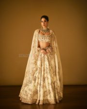 Actress Janhvi Kapoor in a Custom Ivory and Gold Lehenga with a Matching Nude Blouse Photos 02