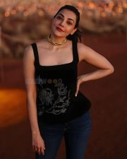 Actress Kajal Aggarwal in a Black Sleeveless Square Neck Top with Blue Denim Jeans Photo 01