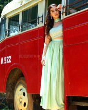 Actress Nikki Galrani in a Light Green Lehenga Set on a Red Bus Photos 01