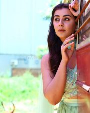 Actress Nikki Galrani in a Light Green Lehenga Set on a Red Bus Photos 03