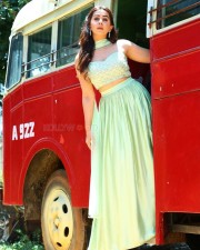 Actress Nikki Galrani in a Light Green Lehenga Set on a Red Bus Photos 05