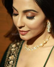 Actress Parvati Nair in a Gold Embroidered Green Blouse and Black Dupatta Photos 02