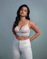 Actress Ramya Pandian in a White Elegant Sexy Bralette Photos 01