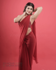 Alluring Actress Yashika Aannand in a Red Sheer Saree with Sequin Blouse Photos 02