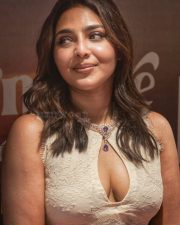 Alluring Aishwarya Lekshmi Cleavage in a White Lace Keyhole Dress Photos 04