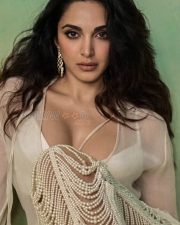 Alluring Kiara Advani Cleavage in an Ivory Sheer Pearl Ensemble Photos 02