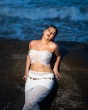 Alluring Yashika Aannand Cleavage in a White Pearl Bandeau Top Photos 03
