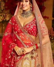 Attractive Janhvi Kapoor in a Traditional Radiant Red and Mustard Bridal Art Silk Lehenga Pictures 01