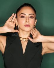 Attractive Rakul Preet Singh in a Black Sleeveless Blazer Dress with Deep V Neckline Pictures 01