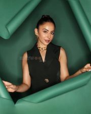 Attractive Rakul Preet Singh in a Black Sleeveless Blazer Dress with Deep V Neckline Pictures 03