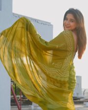 Beach Actress Sakshi Agarwal in a colorful floral crop top and blue shorts Photos 02