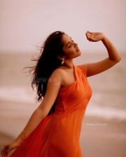 Beautiful Anikha Surendran at the Beach in an Orange Dress Pictures 01