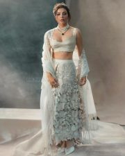 Beautiful Kajal Aggarwal in a White Embroidered Lehenga Photos 07