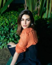 Beautiful Kriti Sanon in an Orange and Black Pullover Top with Black Palazzo pants Photos 02