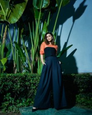 Beautiful Kriti Sanon in an Orange and Black Pullover Top with Black Palazzo pants Photos 03