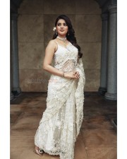 Beautiful Nidhhi Agerwal in a White Transparent Saree Photos 04