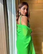 Beautiful Pooja Hegde in a Green Embroidered Saree with Sleeveless Blouse Photos 03