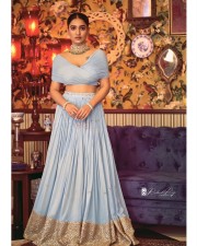 Beautiful Saniya Iyyappan in a Blue Lehenga Dress Photos 01