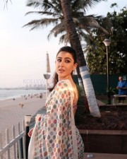 Beautiful Sara Ali Khan in a White Floral Saree with Pink and Blue Sleeveless Blouse Pictures 01