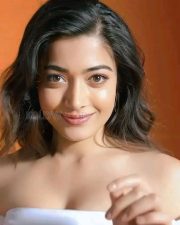 Beauty Queen Rashmika Mandanna in a White Off Shoulder Top and Denim Pant Photos 02