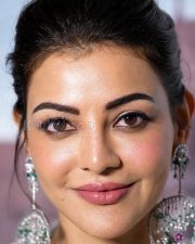 Bewitching Actress Kajal Aggarwal in a White Silver Ethnic Bridal Outfit Silver Diamond Chandelier Earrings Photos 01