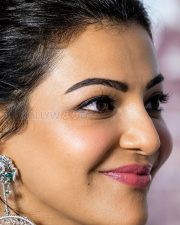 Bewitching Actress Kajal Aggarwal in a White Silver Ethnic Bridal Outfit Silver Diamond Chandelier Earrings Photos 02