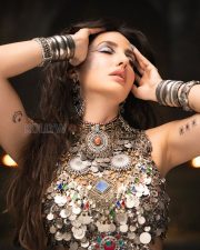 Body Roll Actress Nora Fatehi in a Tribal Silver Coin Top Photos 03