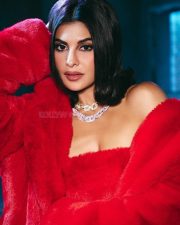 Bold Glam Jacqueline Fernandez in a Red Strapless Crop Top Mini Skirt and Thigh High Boots Photos 01
