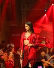 Bold Pooja Hegde in a Red Sequinned Bralette with an Oversized Blazer and Shimmery Pant at Mahindra Tech Fashion Tour Pictures 06