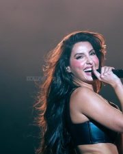 Bold and Glamorous Nora Fatehi in a Sleek Black Leather Corset Style Crop Top and High Waisted Magenta Pink Trousers Pictures 03