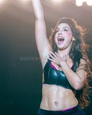 Bold and Glamorous Nora Fatehi in a Sleek Black Leather Corset Style Crop Top and High Waisted Magenta Pink Trousers Pictures 04